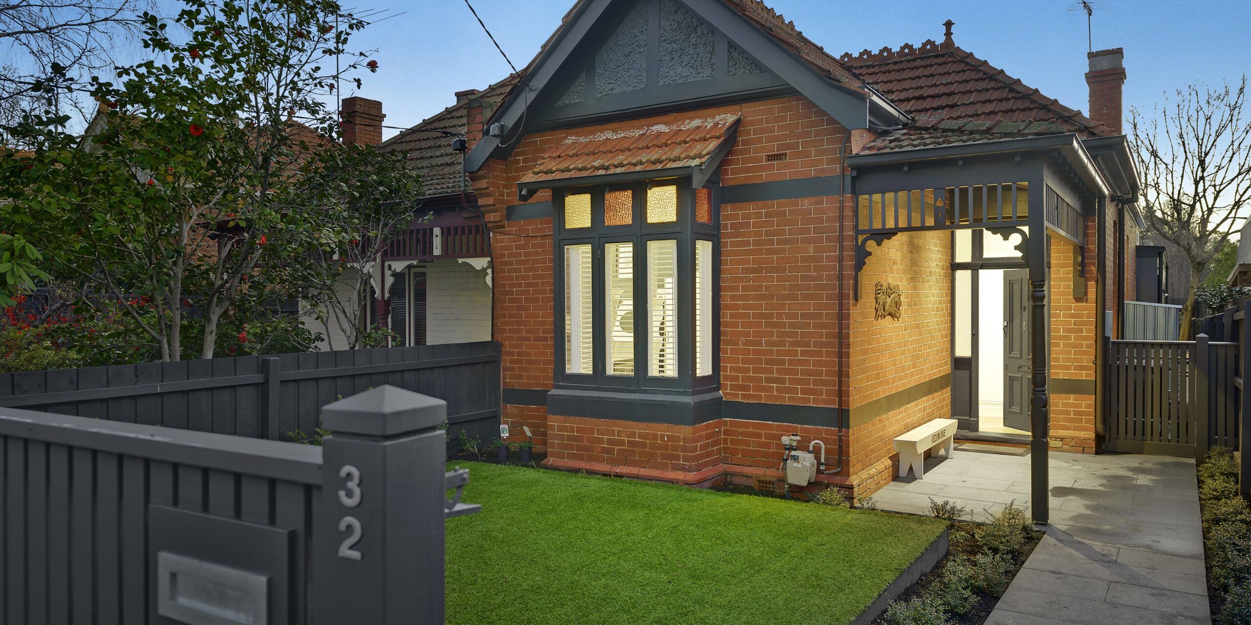 Residential remodeling services austin tx featuring a recently remodeled red-brick home with gabled roof and updated entrance