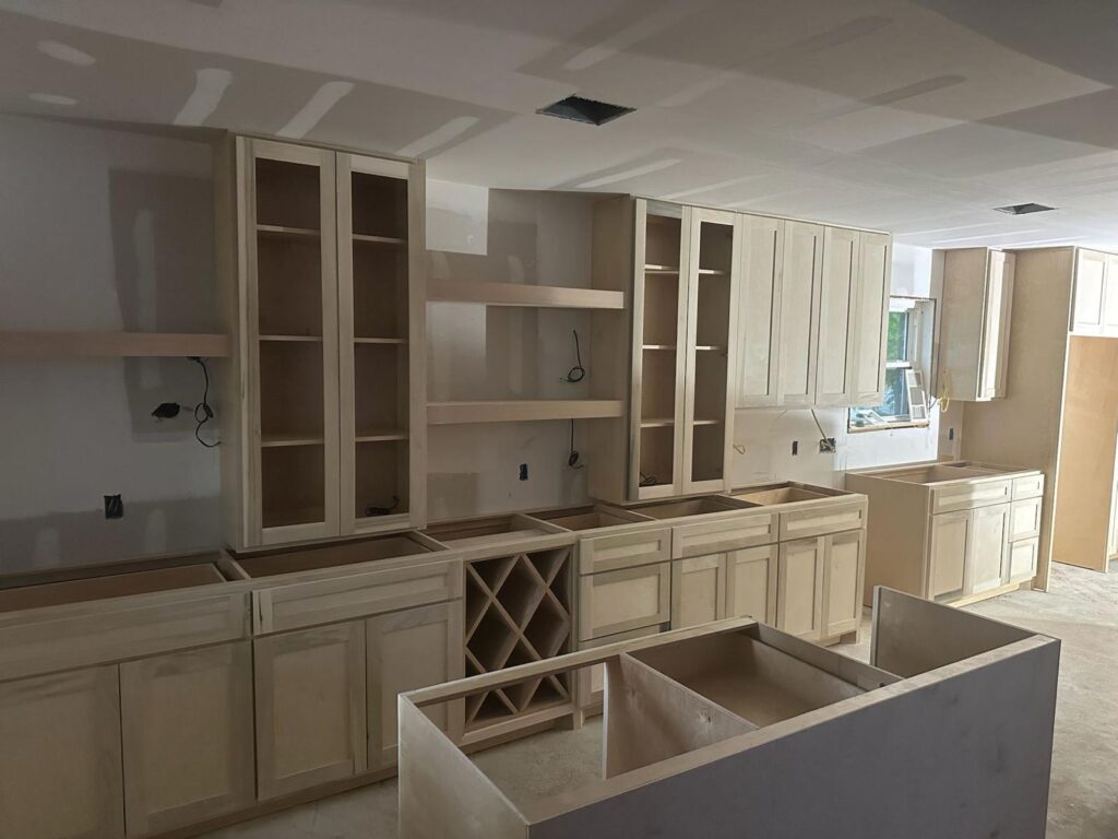 Kitchen remodeling company Austin showcasing Austin kitchen remodel with unfinished cabinets, open shelves, and natural light